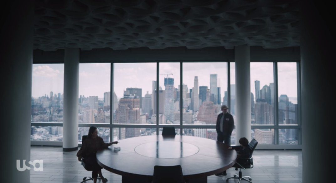 Mr. Robot talks to Magda and the Young Elliot in a boardroom