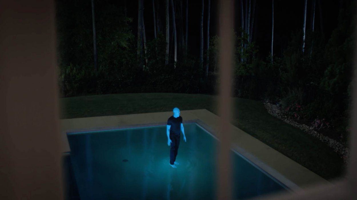 Dr. Manhattan walks on water on his family's pool.