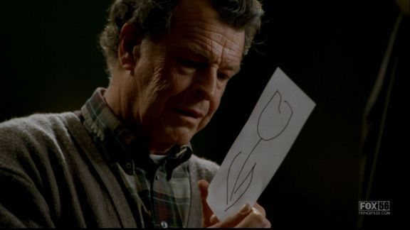 Walter Bishop looking at a picture of a white tulip