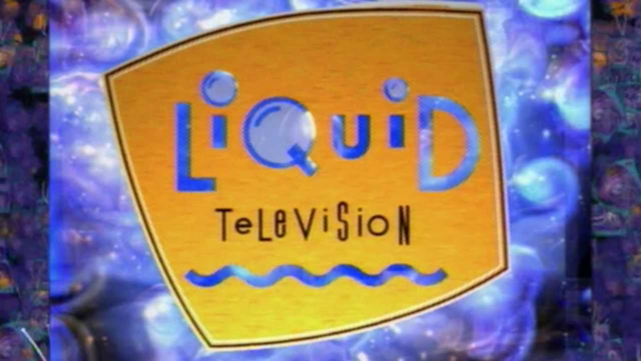 A yellow oblong sign, with stylized "liquid" in blue, alternating upper/lower case "television" in black, and all in front of a purple swirly background.
