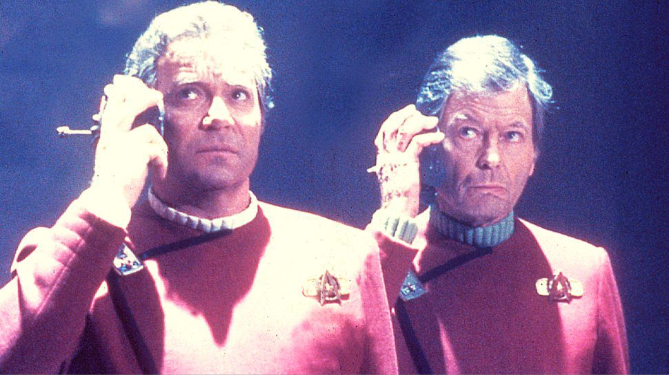 Kirk and McCoy listen to something in the original Star Trek