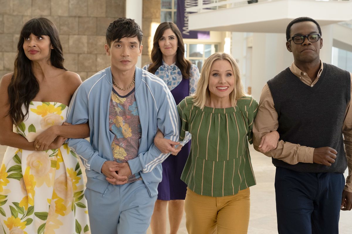 Tahani, Jason, Eleanor, and Chidi lock arms as Janet stands behind them in The Good Place