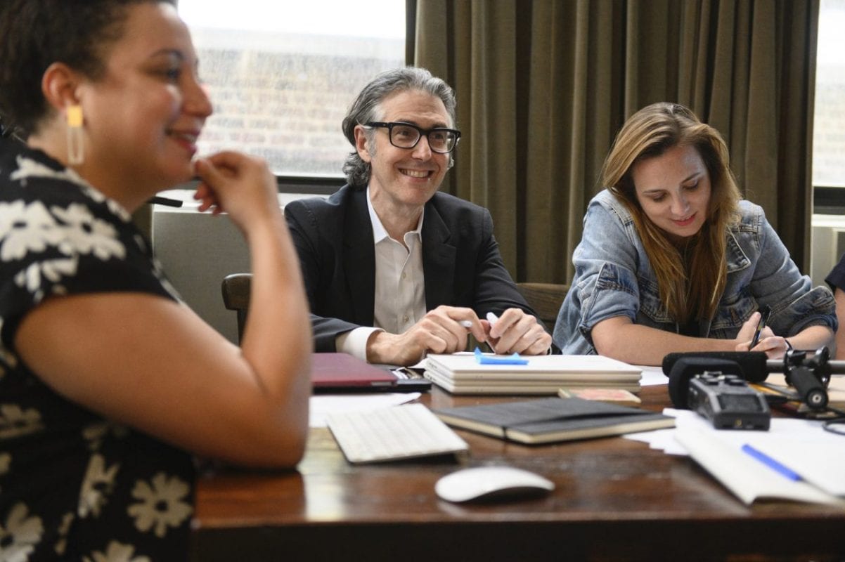 Yara sits in a meeting with Ira Glass and the This American Life team