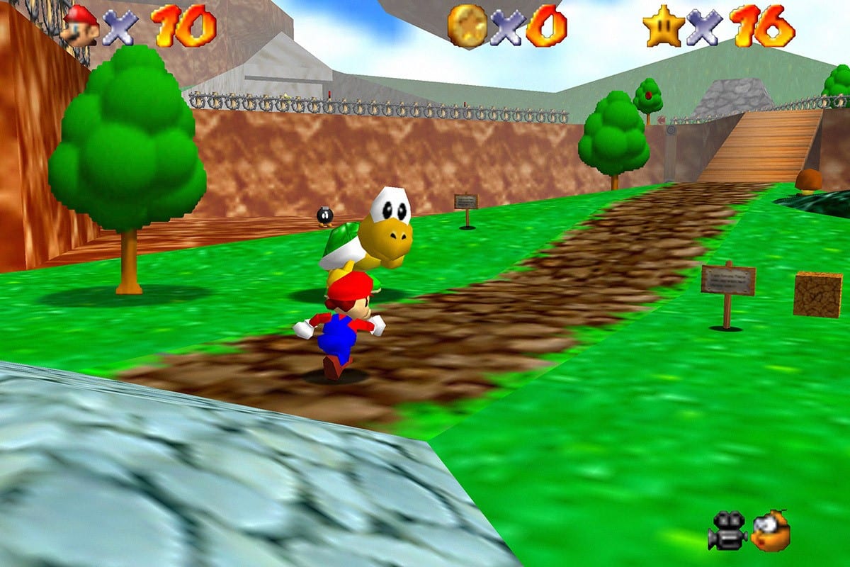 Mario in the first level of the game, running down a path with a Koopa next to him.
