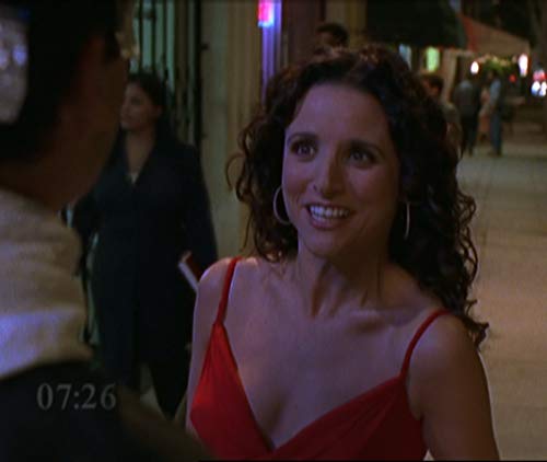 Julia Louis-Dreyfus in the pilot of Watching Ellie with the clock on the screen