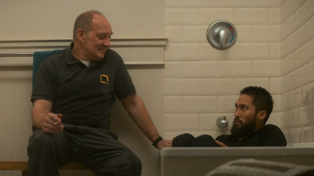 Kenton talks to Jamie, who is sitting in a bathtub in Devs S1E5