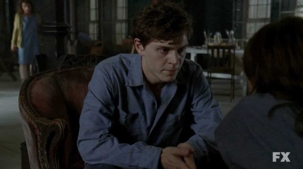 Inmate Kit Walker, seated in the common room of the asylum