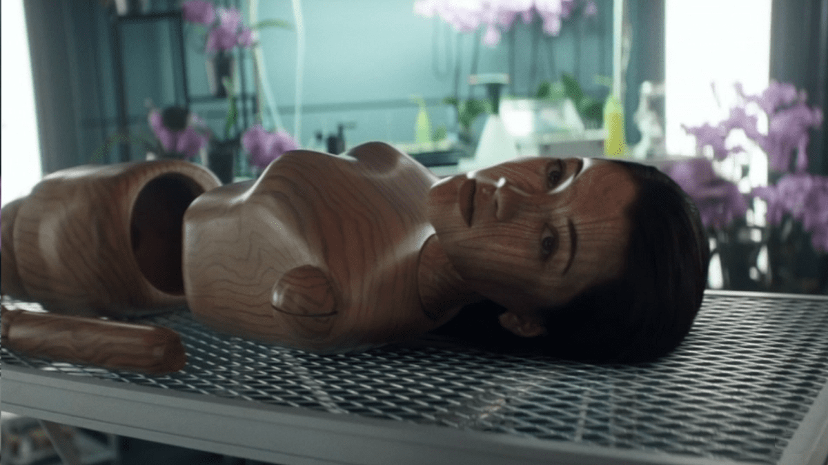 Picard S1E6 - Soji lies on a table as a life-sized wooden doll taken apart