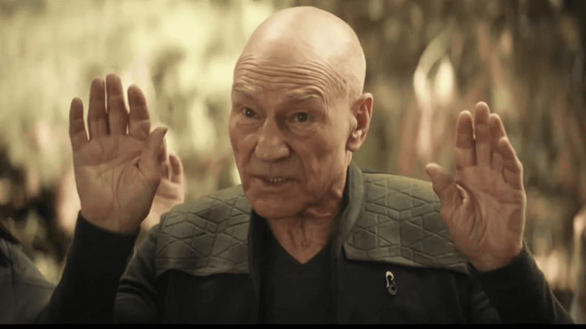 Picard with hands up in a gesture of surrender