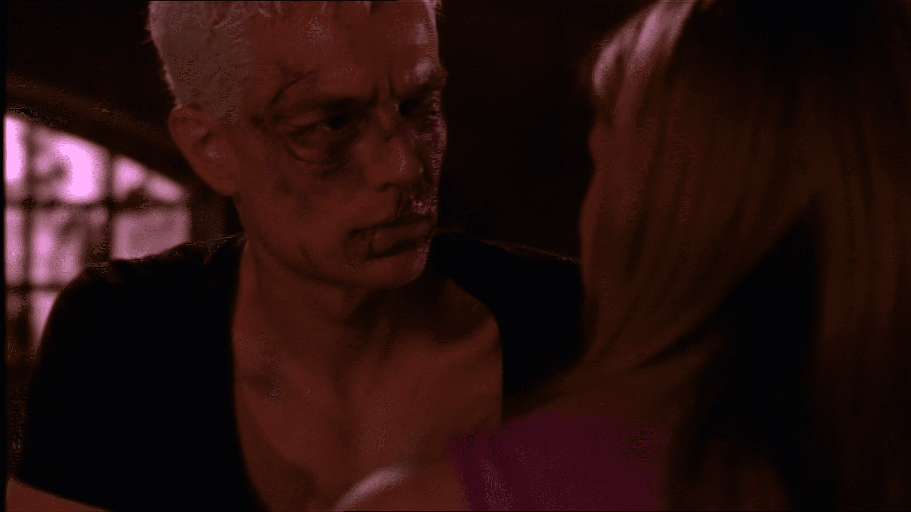 A beaten up Spike looks at Buffy