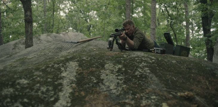 Jack in sniper position surrounded by ammo