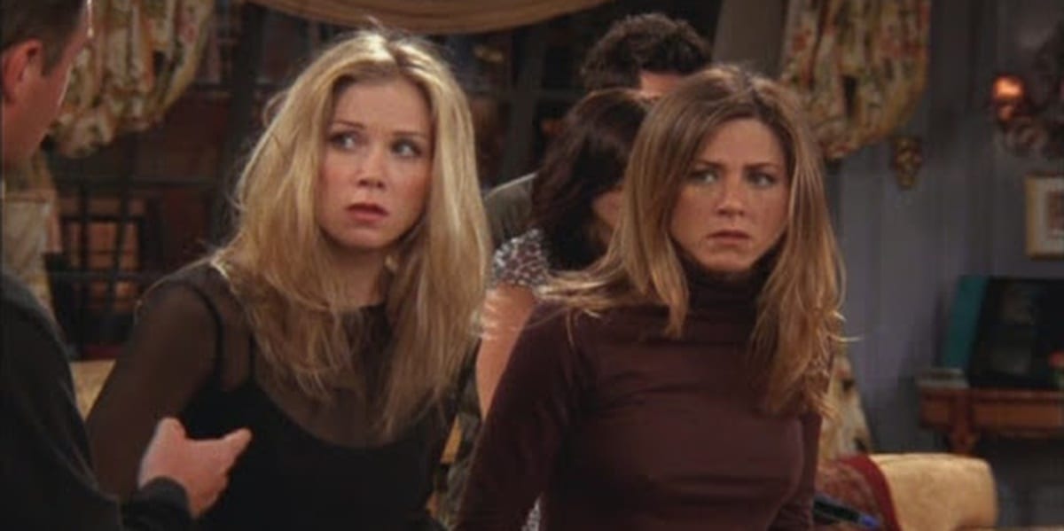 Christina Applegate and Jennifer Aniston on Friends looking to their left and looking nervous