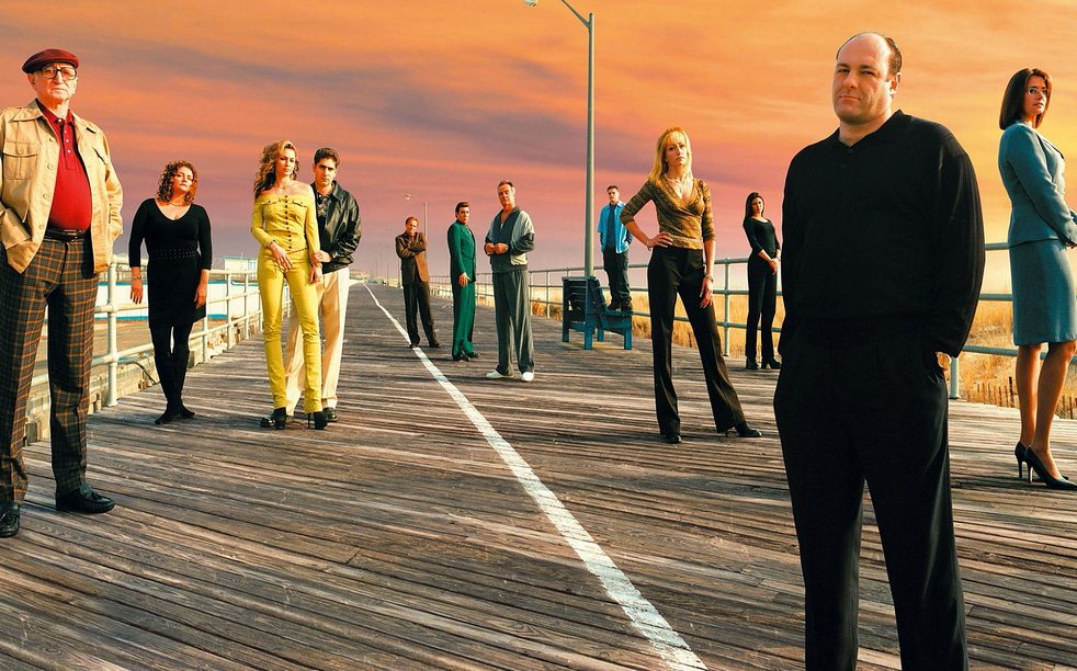 The cast of the Sopranos standing on a boardwalk