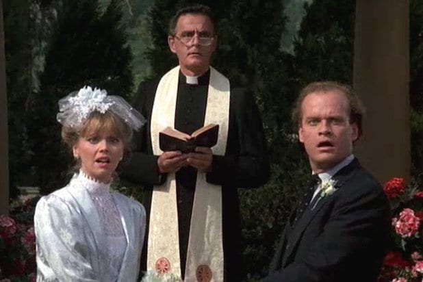 Frasier and Diane Chambers stand at the altar with a priest in the background before Diane leaves Frasier