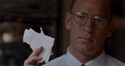 Smarmy Skinner holds pieces of ripped papers in his fingers. His head is cocked as if to say you can’t be serious.