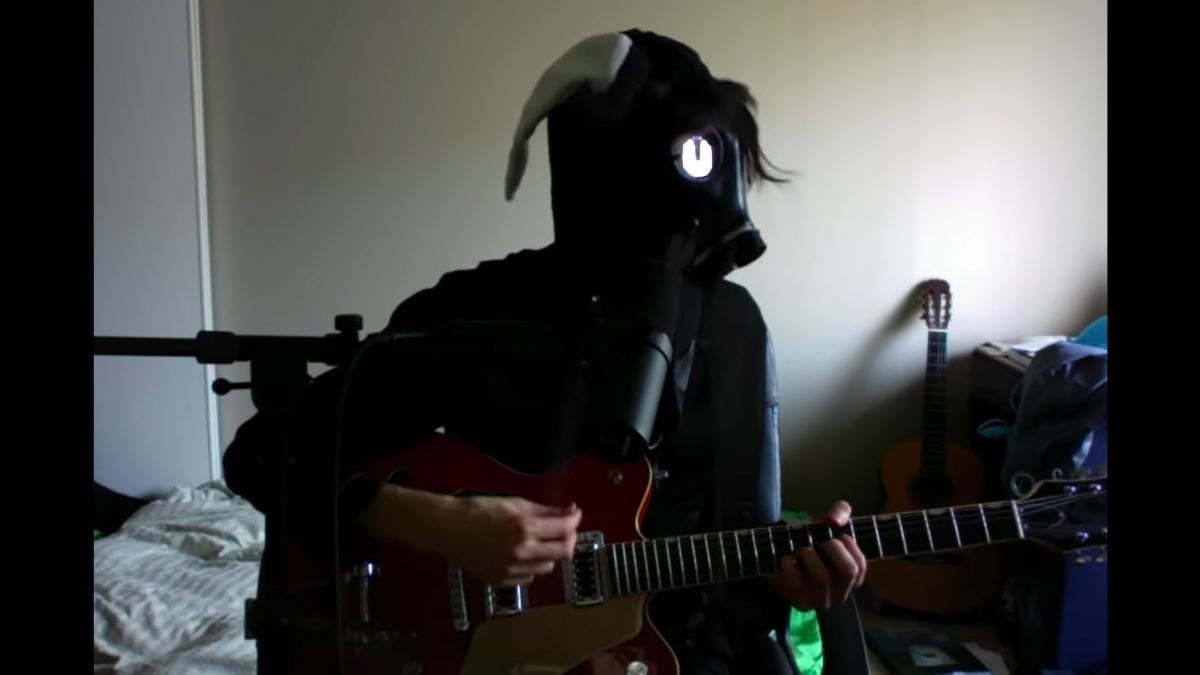 Will Toledo in his new stage persona wearing a gas mask in the video for "There must be more than blood"