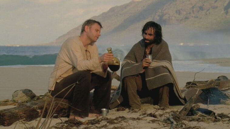 Jacob and Richard share wine on the beach