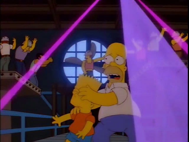 Homer covers Bart's eyes in a steel mill that's turned into a gay club