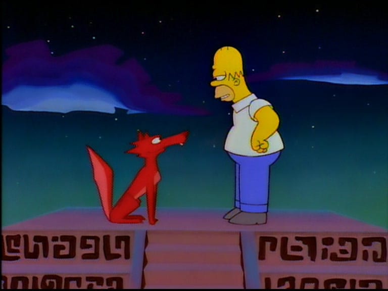 Homer stands on top of a pyramid with the coyote in his hallucination