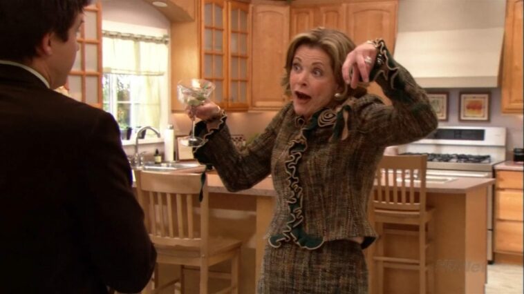 Lucille throws her hands up to mock her son