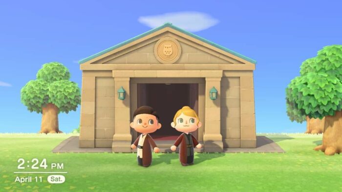 My girlfriend's and my character posing for a photo in front of the museum in Animal Crossing.