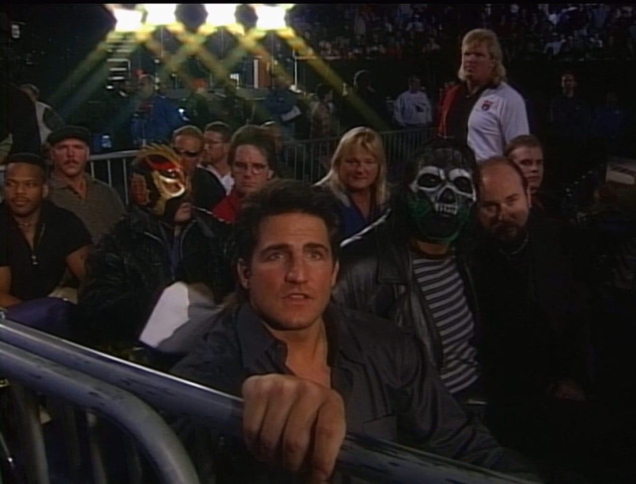 WCW wrestlers in the stands at Starrcade 1997