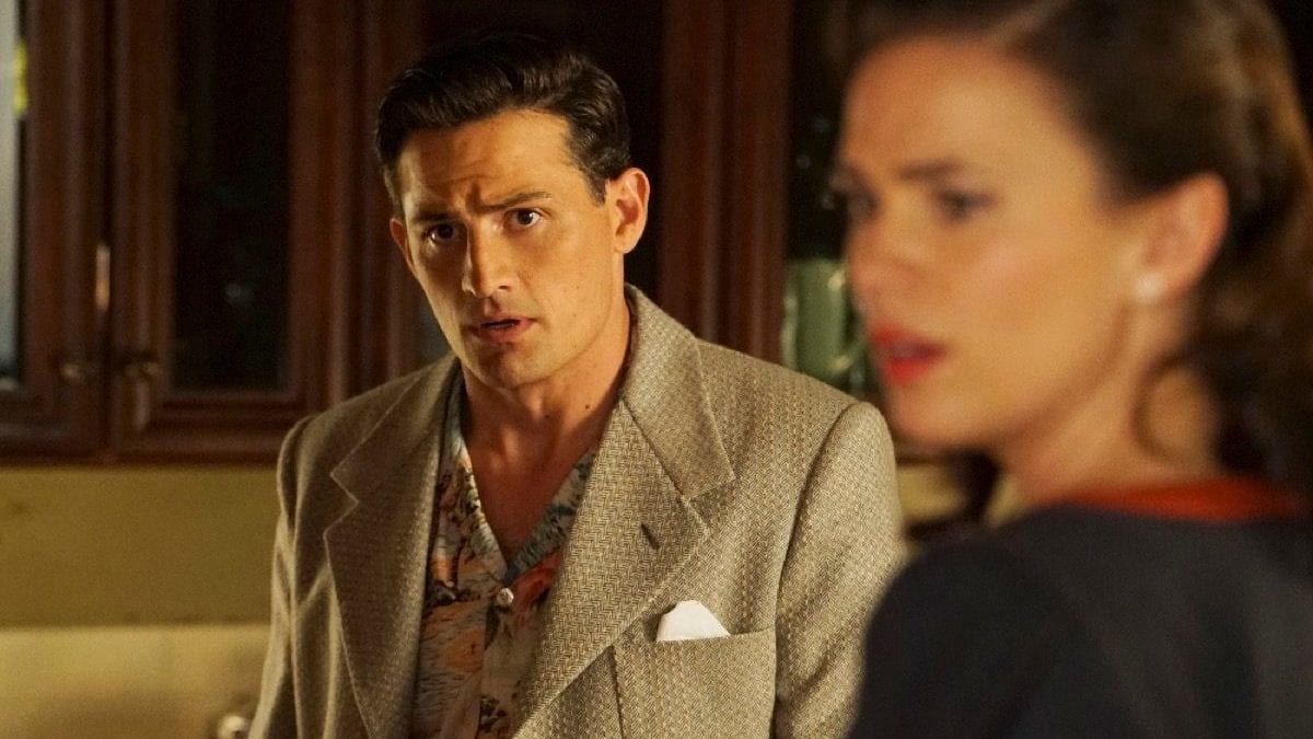  Daniel Sousa (Enver Gjokaj) and Peggy Carter (Hayley Atwell) look off in the distance in "Agent Carter." 
