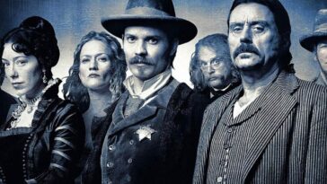A black and white group shot of some of the cast of Deadwood