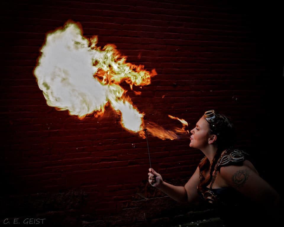 Xena cosplayer breathing fire