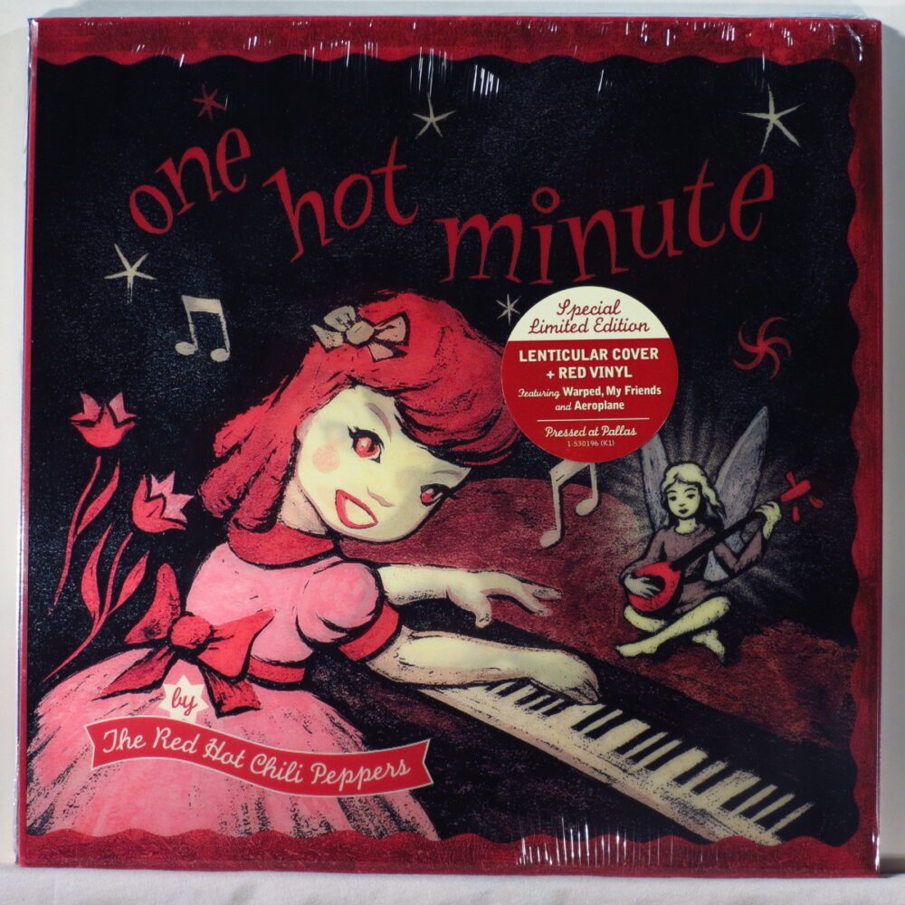 a cartoon girl with a pink dress and red hair happily turns to the camera while playing piano happily.