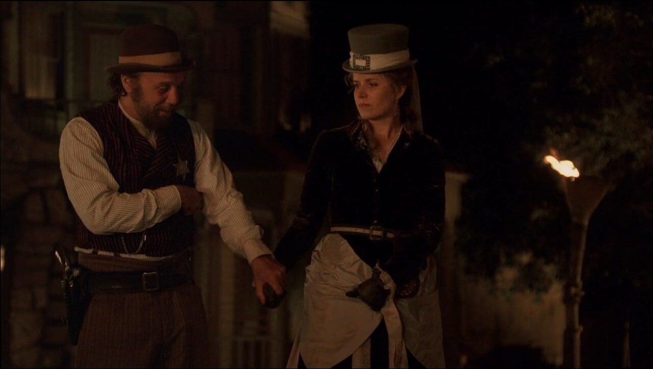 Charlie Utter (Dayton Callie) comforts a distraught Joanie (Kim Dickens) in a scene from Deadwood.
