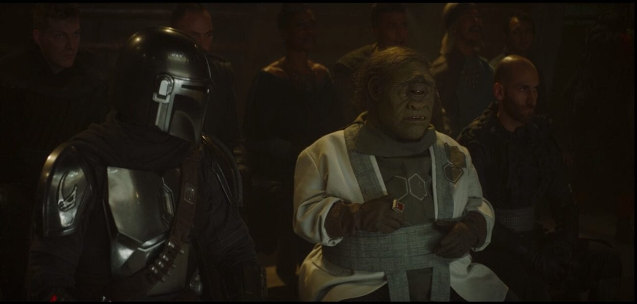 The Mandalorian and Gor Koresh talk from the front row of a fight