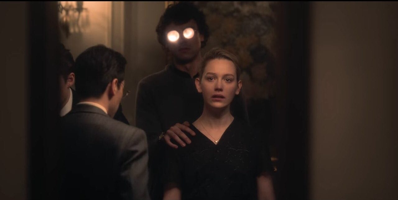 Dani is haunted by Edmund while attending his wake, as he appears behind her with a hand on her shoulder