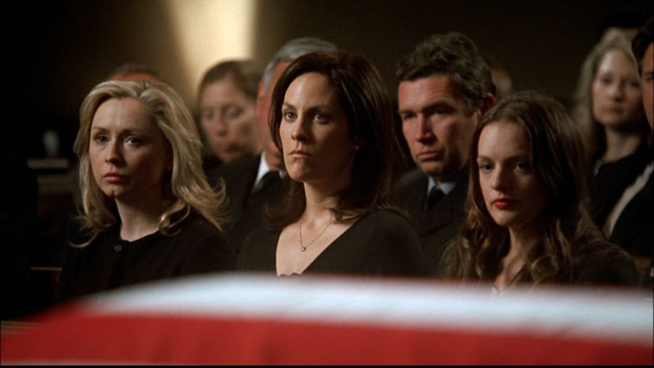 The three Bartlet daughters seated together at the funeral