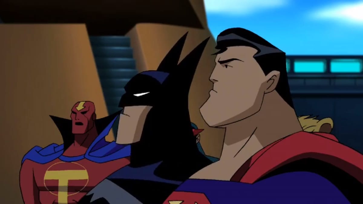 Superman and Batman stand in profile. Red Tornado stands in the background.