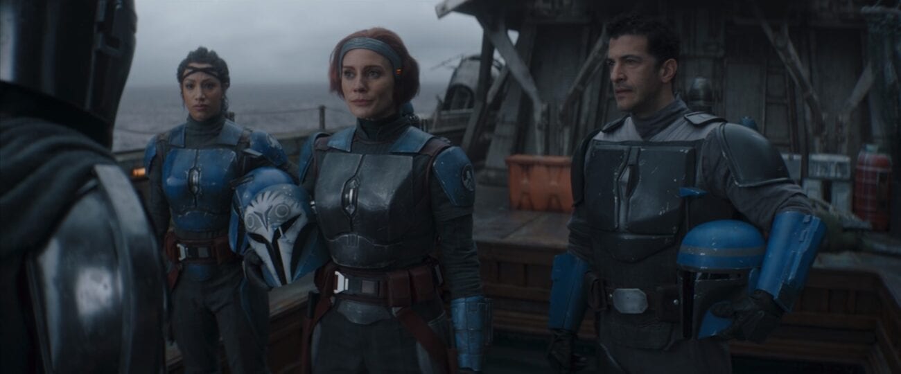 Three Mandalorians talk to Mando, with their helmets removed