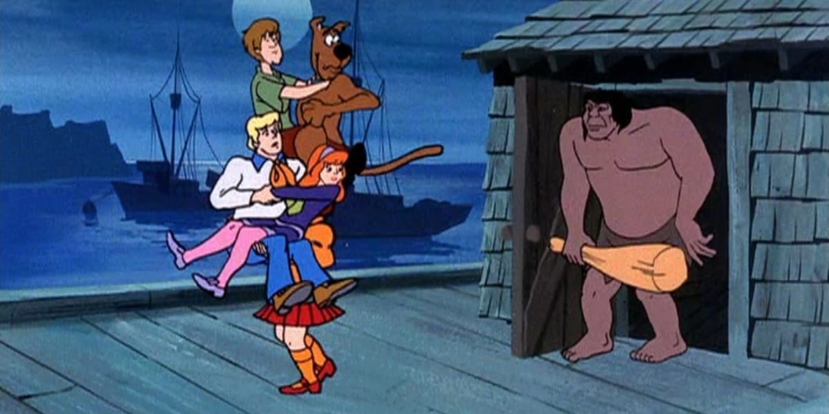 Scooby and the gang being chased by The Caveman in Scooby-Doo Where Are You