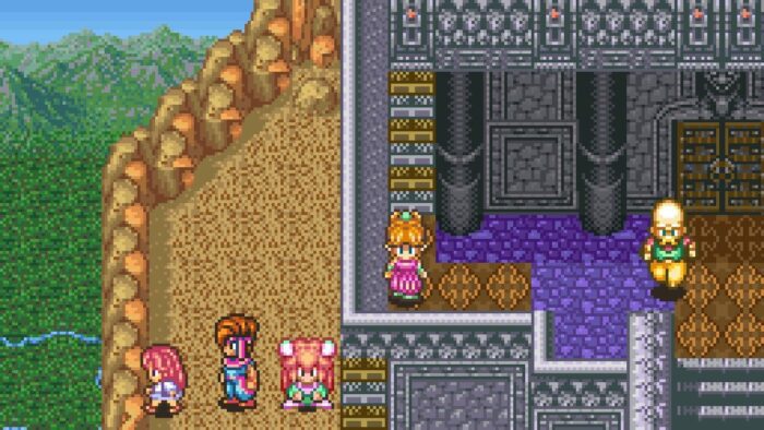 The characters in Secret of Mana stand on a mountain top near a fortress