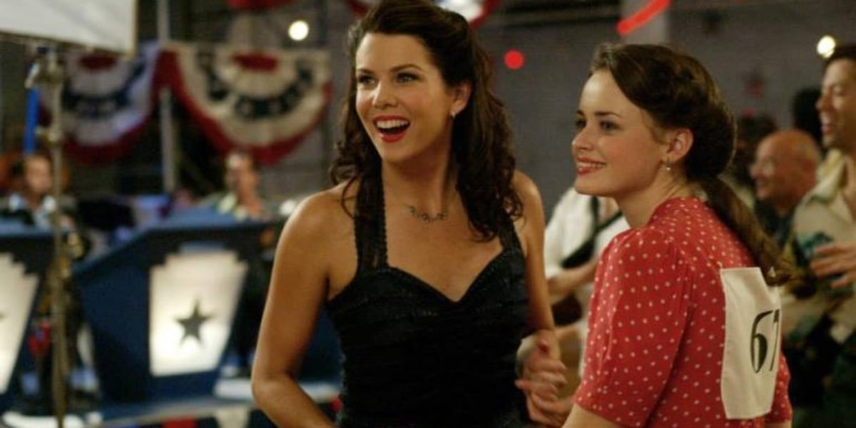 Lorelai and Rory in dresses at a dance in Gilmore Girls a great 2000s TV show