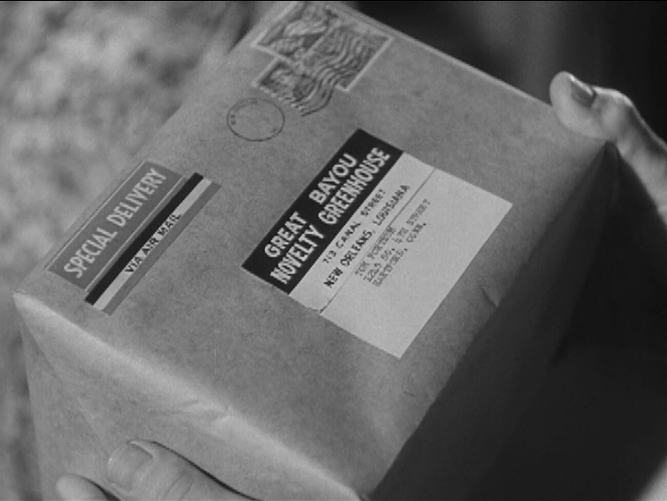 A special delivery box is held in a Cynthia's hands in Alfred Hitchcock Presents "Special Delivery"