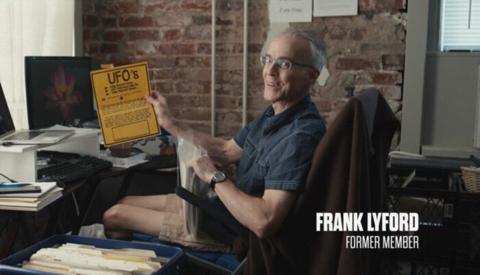 Frank Lyford sits in his home office