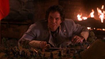 Ben Horne is confident and happy about his civil war figurines battle, and a fireplaces crackles behind him.