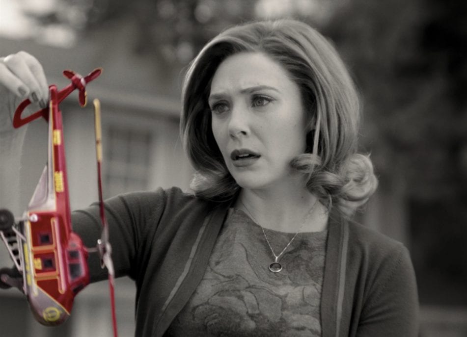 Wanda Maximoff (Elizabeth Olsen) holds a colorful helicopter toy in Marvel and Disney+'s WandaVision
