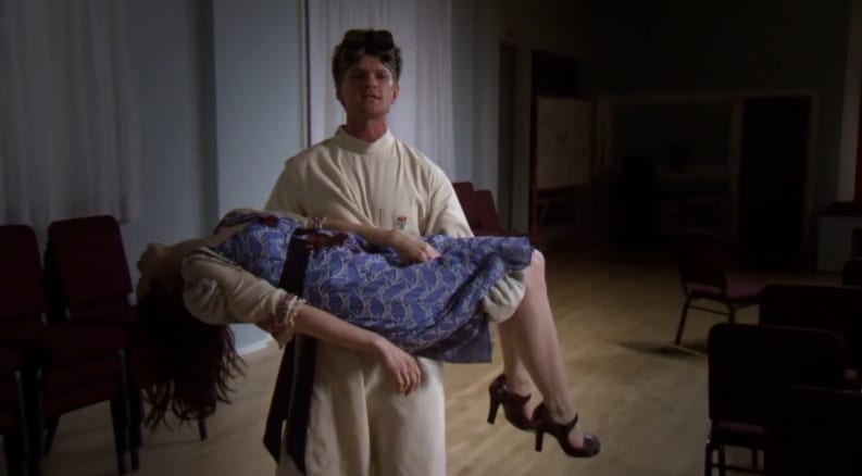 Billy (Dr. Horrible) carries Penny's dead body.