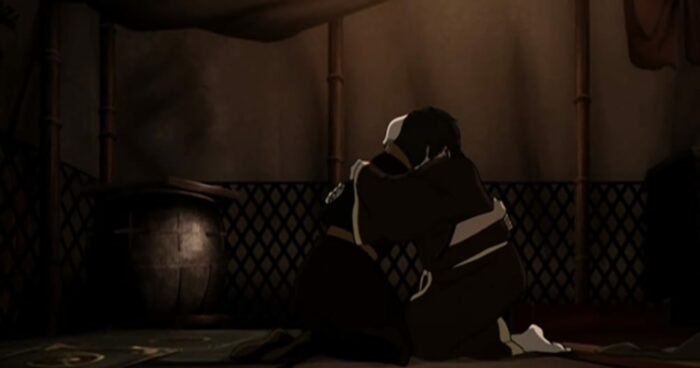 Iroh and Zuko hug while knelling in Iroh's tent