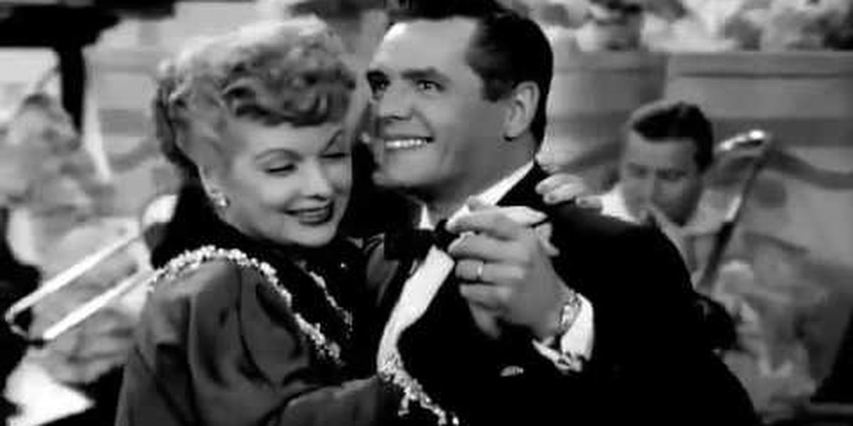 Black and white photo of Ricky and Lucy dancing cheek to cheek in I Love Lucy
