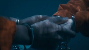 A pair of holding hands, in handcuffs and underwater in The Stand Episode 8