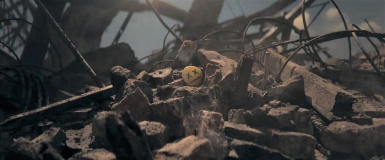 The Stand Episode 9 - Flagg's button, with X's for the eyes, sits on top of a pile of building rubble