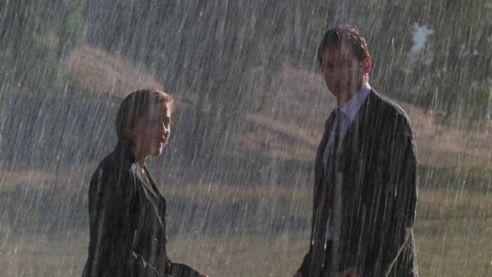 Mulder and Scully soaked in the rain...