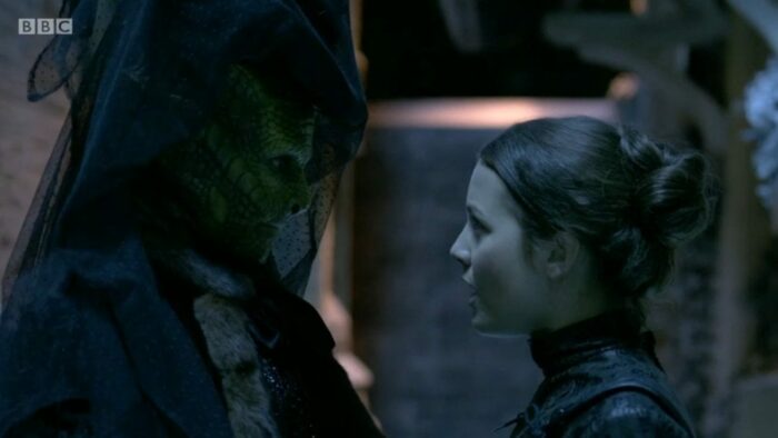 Vastra and Jenny face each other, deep in conversation